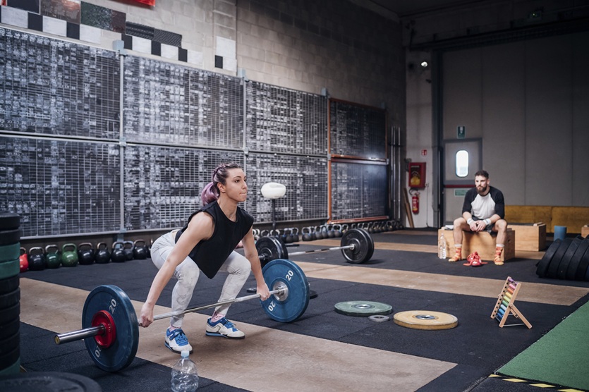Individual experiencing strength-training plateaus during a home workout