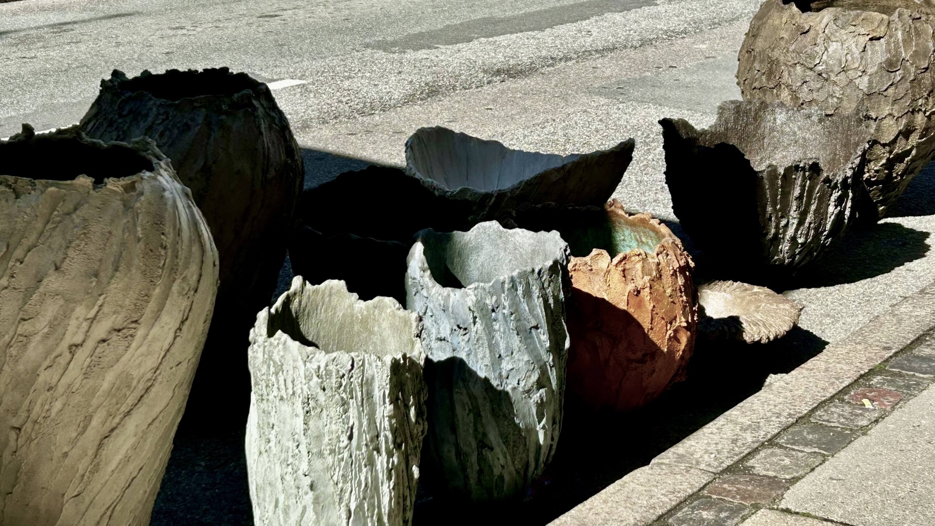 Concrete vessels and reliefs by Susanne Storm merge artistic expression, material knowledge and functional purpose. Working with a material traditionally associated with weight, Storm challenges expectations by sculpting within a brief and intense creation window. This urgency is reflected in the works, whose forms appear almost alive, retaining the movement that shaped them. Cracks, layers and surface marks remain as traces of transformation. A restrained use of colour allows each piece to stand beautifully alone or in dialogue with others, particularly in contrast to modern, austere design. Suitable for both indoor and outdoor use.