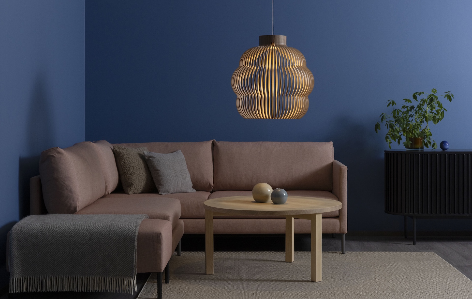 Secto Design is a Finnish family–owned company known for its architectural, wooden design lamps. Each lamp is meticulously handmade at the company’s factory in Heinola, Finland, where locally sourced, certified birch wood meets sustainable production methods. The harmonious light of the luminaires and the warm tones of wood create an inviting atmosphere in both private and public spaces.