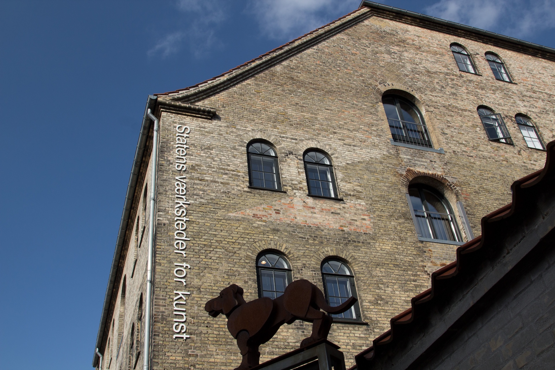 Danish Art Workshops contributes to the field of art and design in Denmark by offering professionals a unique platform for artistic development and production. Across its many specially equipped workshops, professional artists and designers can apply for residency to develop ideas and produce large–scale and complex works, supported by guidance and expertise from skilled professionals. This is where much contemporary art and design takes root, and where new talents within the art and design scene are nurtured.