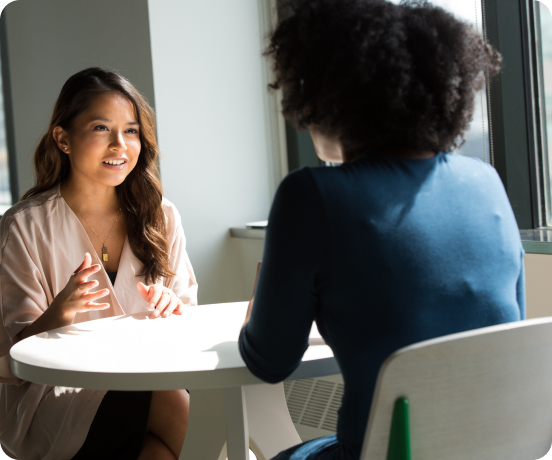 two women sitting having an interview