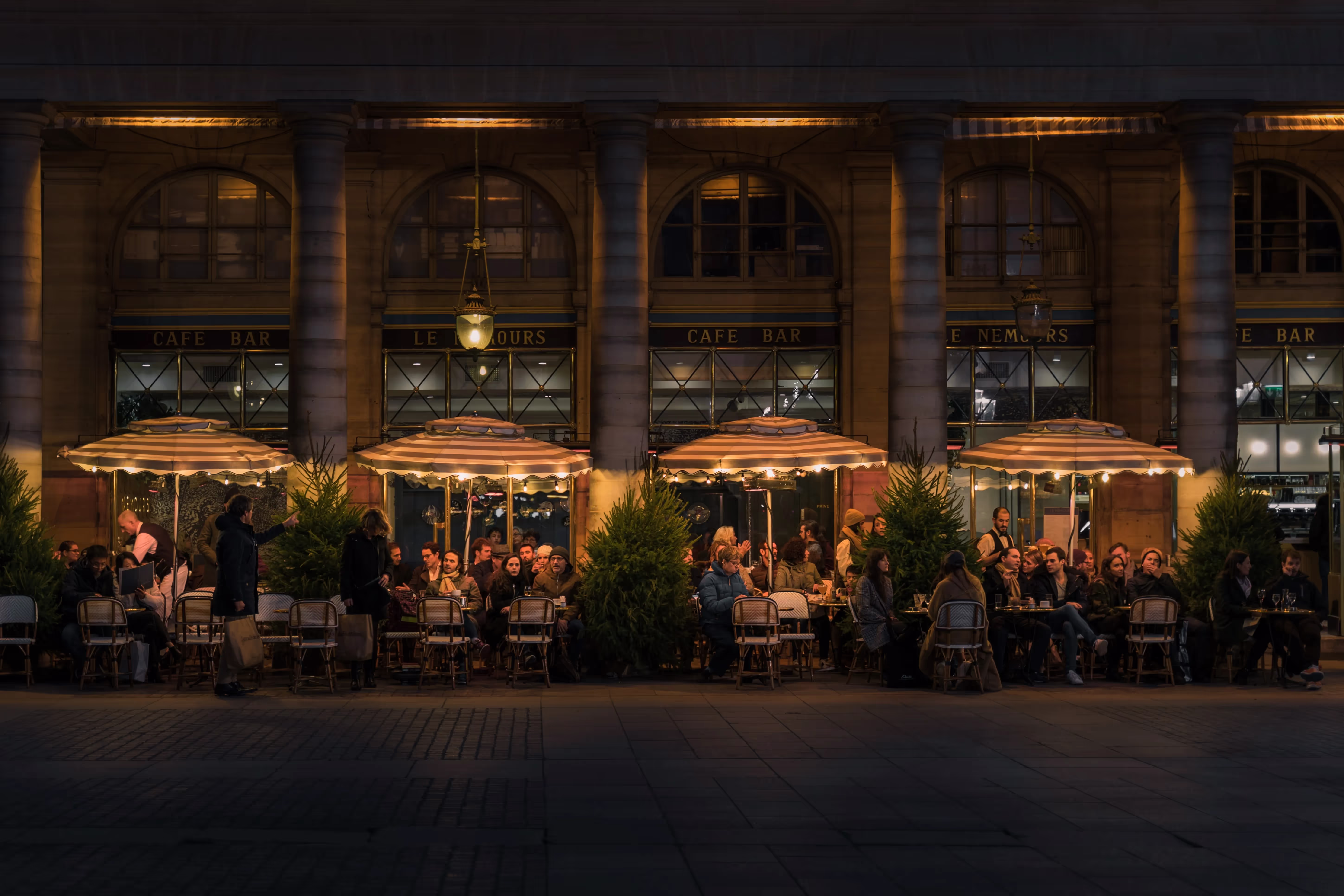A terrace on the street by night in London.