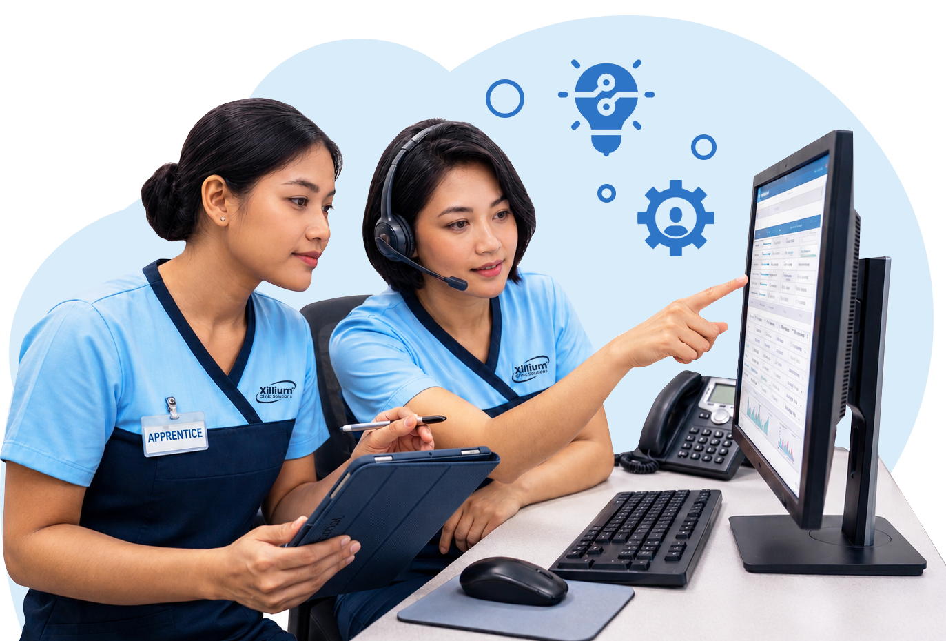 Xillium VMA Apprentice Specialists working together at a computer