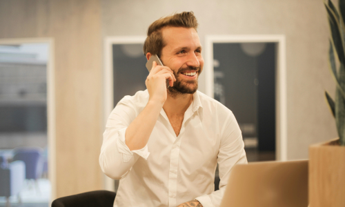 Business man with laptop and phone