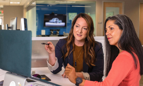 Two business women talking