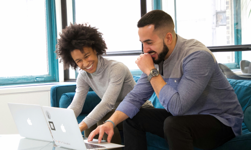 Two colleagues at laptop