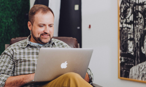 Business man sitting at laptop
