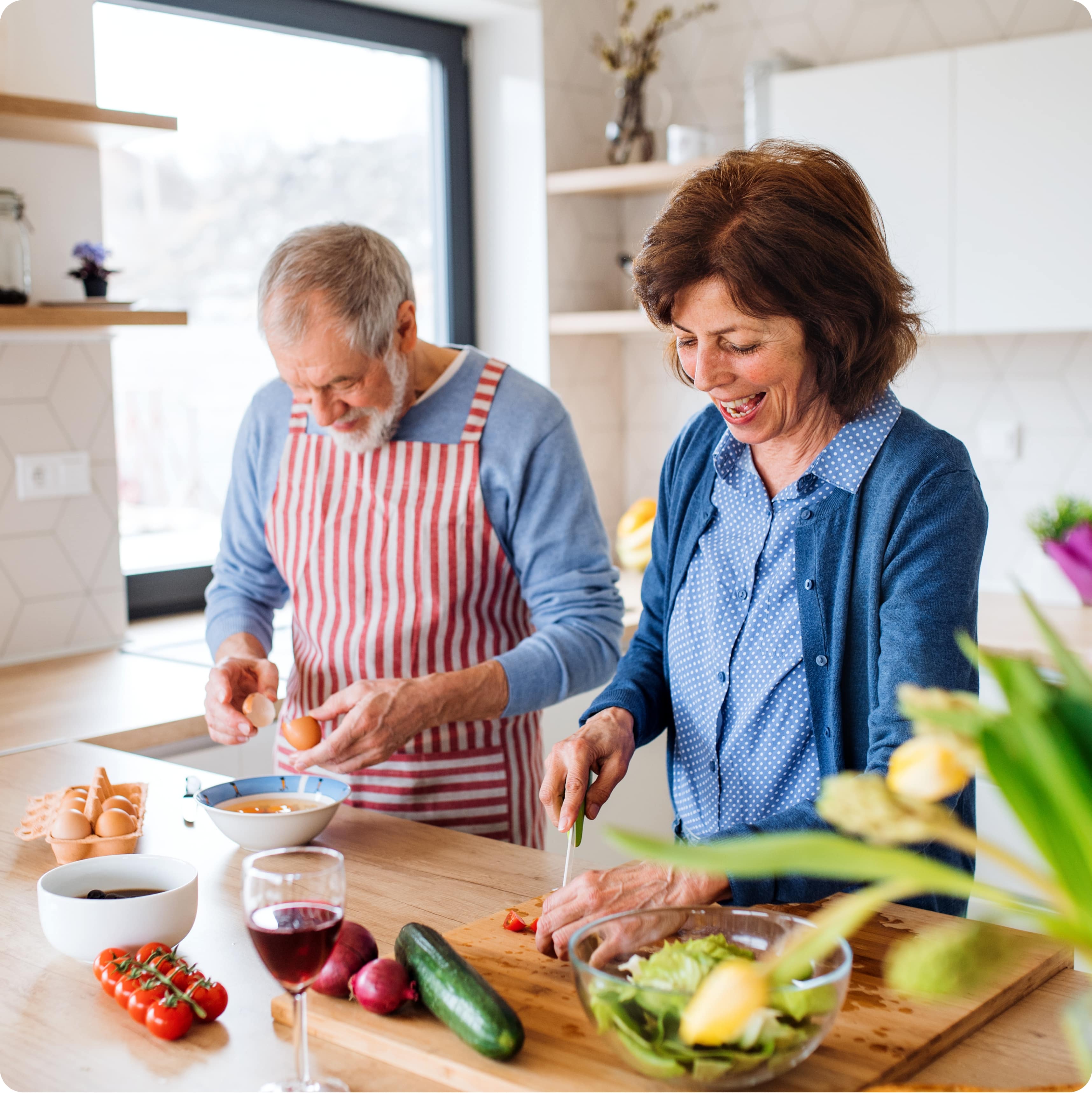 older couple cooking togehter
