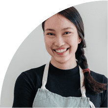woman in overalls with braided hair