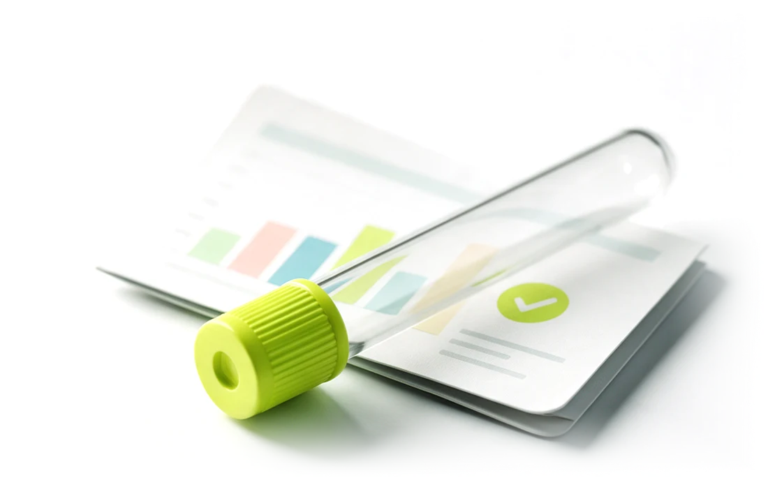 A health report with a lime check mark and a blood-collection tube