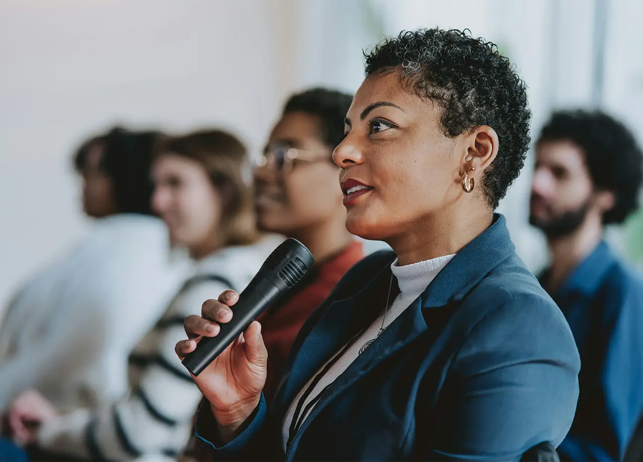 A member of a keynote audience asking a question.