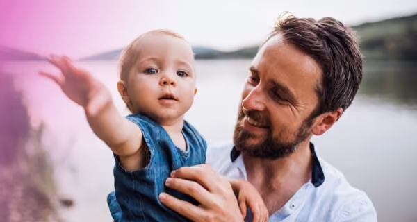 Young father holding the baby son