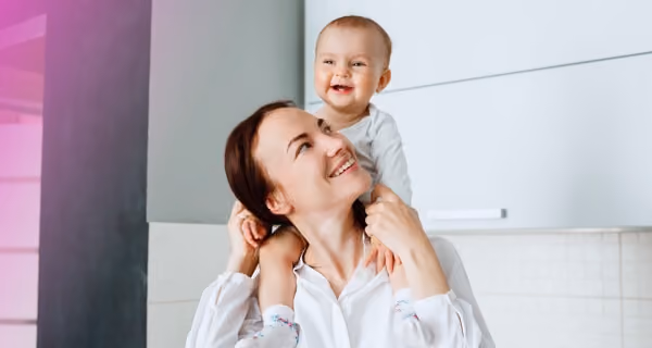 Mother and child playing in modern house