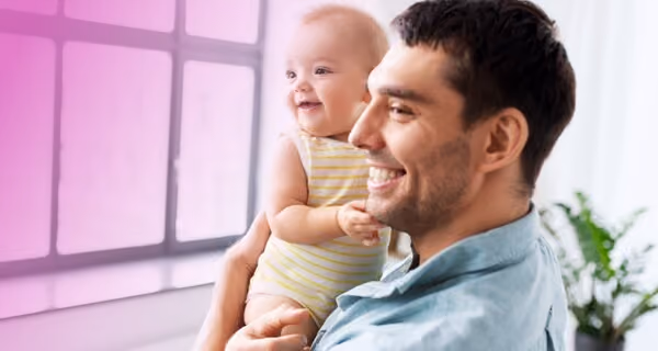 Young father showing the view to his toddler