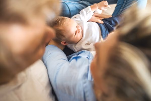 Young couple holding their newborn child
