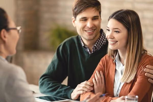 A young couple at the IVF clinic discussing laws and regulations