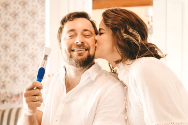 Young couple celebrate their pregnancy