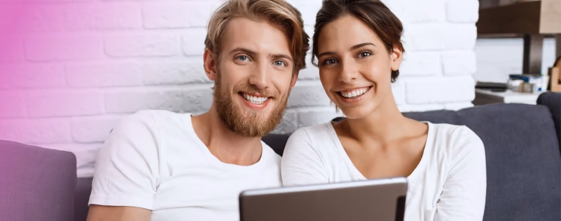 A young couple doing research on a laptop