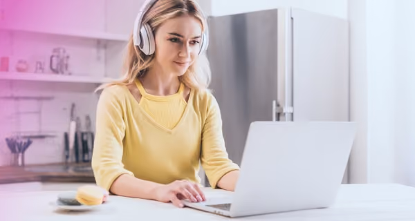 Young woman doing diet research on her laptop
