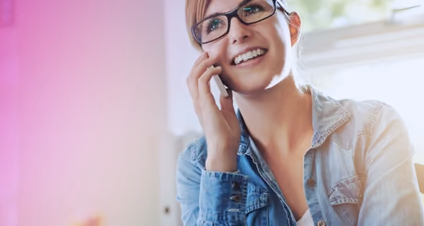 Female patient books an appointment with a family therapist on her mobile phone