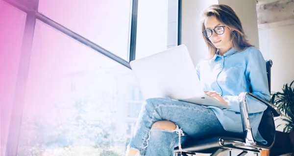 A young female patient reading on her laptop