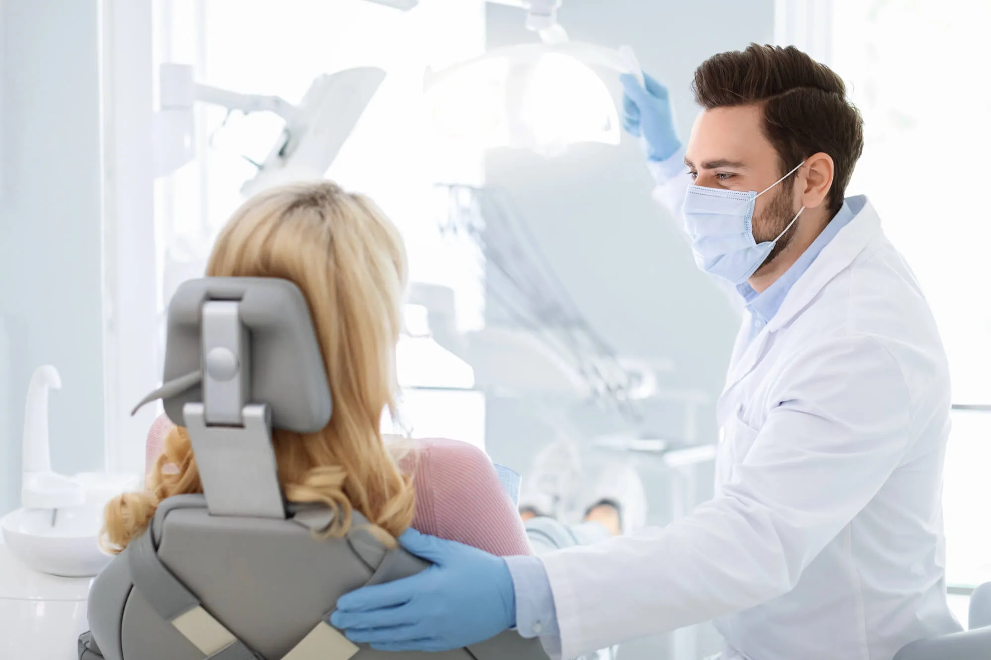 Best dentist in college station tx about to check patient's mouth