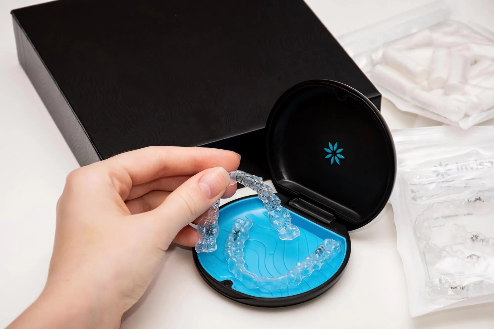 Your morning coffee may be part of your daily routine, so it's natural to wonder whether Invisalign® treatment means giving it up. The good news is that coffee is still on the menu, though you may need to adjust how you enjoy it. Knowing a few simple habits can help keep your aligners clear while supporting your treatment. If you're considering Invisalign braces in College Station, TX, here's what you should know before your next cup. Coffee and Invisalign®: What You Should Know Remove Your Aligners Before Drinking Hot Coffee Hot coffee should not be consumed while wearing your aligners. Heat may warp the plastic, affecting how the aligners fit against your teeth. A poor fit can interfere with the gradual tooth movement your treatment is designed to achieve. Coffee Can Stain Clear Aligners Coffee contains pigments that can discolor clear aligners over time. Although aligners are replaced regularly, staining may make them more noticeable before it's time for your next set. Rinse Before Putting Your Aligners Back In After finishing your coffee, rinse your mouth with water before replacing your Invisalign® aligners. Brushing your teeth is even better if you're able to do so. This helps remove coffee residue and reduces the chance of trapping sugars or acids against your teeth. Frequently Asked Questions Can I drink iced coffee with Invisalign®? It's still best to remove your aligners before drinking iced coffee, since the beverage can stain them, and sugary drinks may increase the risk of tooth decay if they get trapped beneath them. Can I drink water while wearing Invisalign®? Yes. Plain water is safe to drink while wearing your aligners and helps keep your mouth hydrated. Have Questions About Invisalign Braces in College Station, TX? Small daily habits can make a difference throughout Invisalign® treatment. At Cashion Dental, we take time to answer your questions, provide personalized guidance, and help you feel comfortable every step of your care. If you'd like to learn more about Invisalign braces, our team is here to discuss your goals and recommend treatment that fits your smile. Schedule a consultation today! *Invisalign®, the Invisalign logo, and iTero®, among others, are trademarks and/ or service marks of Align Technology, Inc. or one of its subsidiaries or affiliated companies and may be registered in the U.S. and/or other countries.
