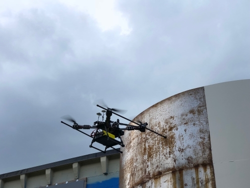A drone performing Non-Destructive Testing