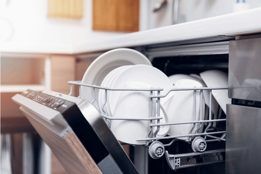 Open dishwasher with clean dishes
