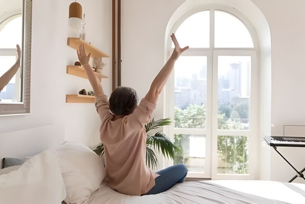 Woman at elevators in front of San Antonio Eye Specialists sign.