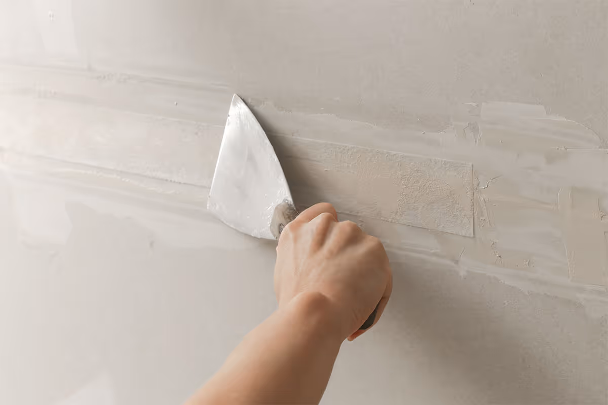 Professional drywall repair is in progress for commercial property maintenance.