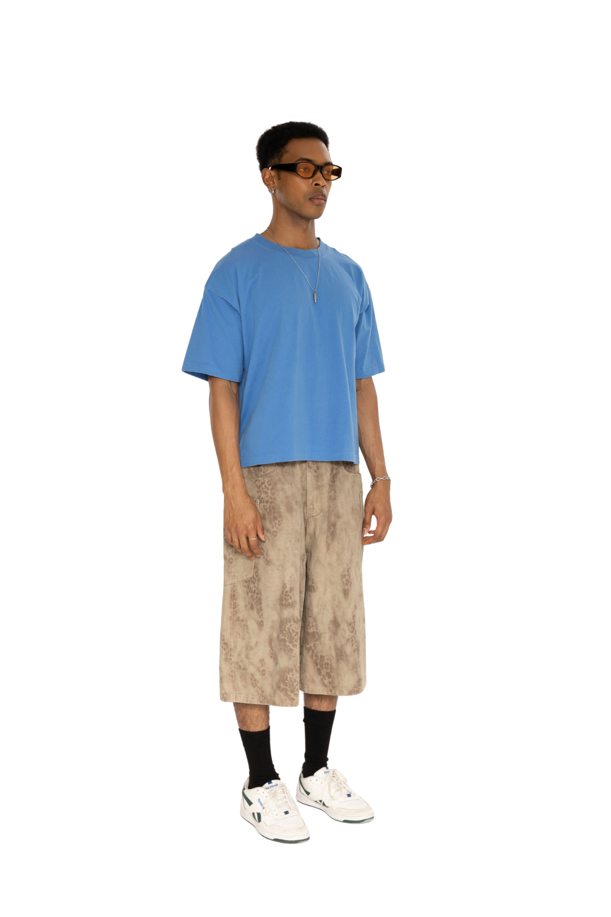 Blue washed boxy tee worn with washed shorts, full-length view