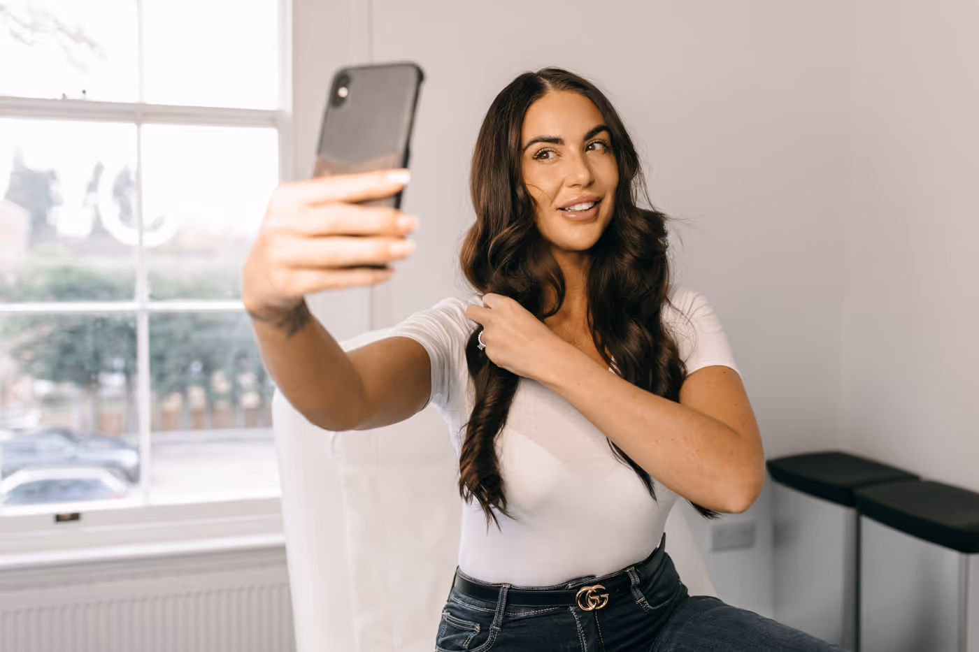 happy client looking at herself