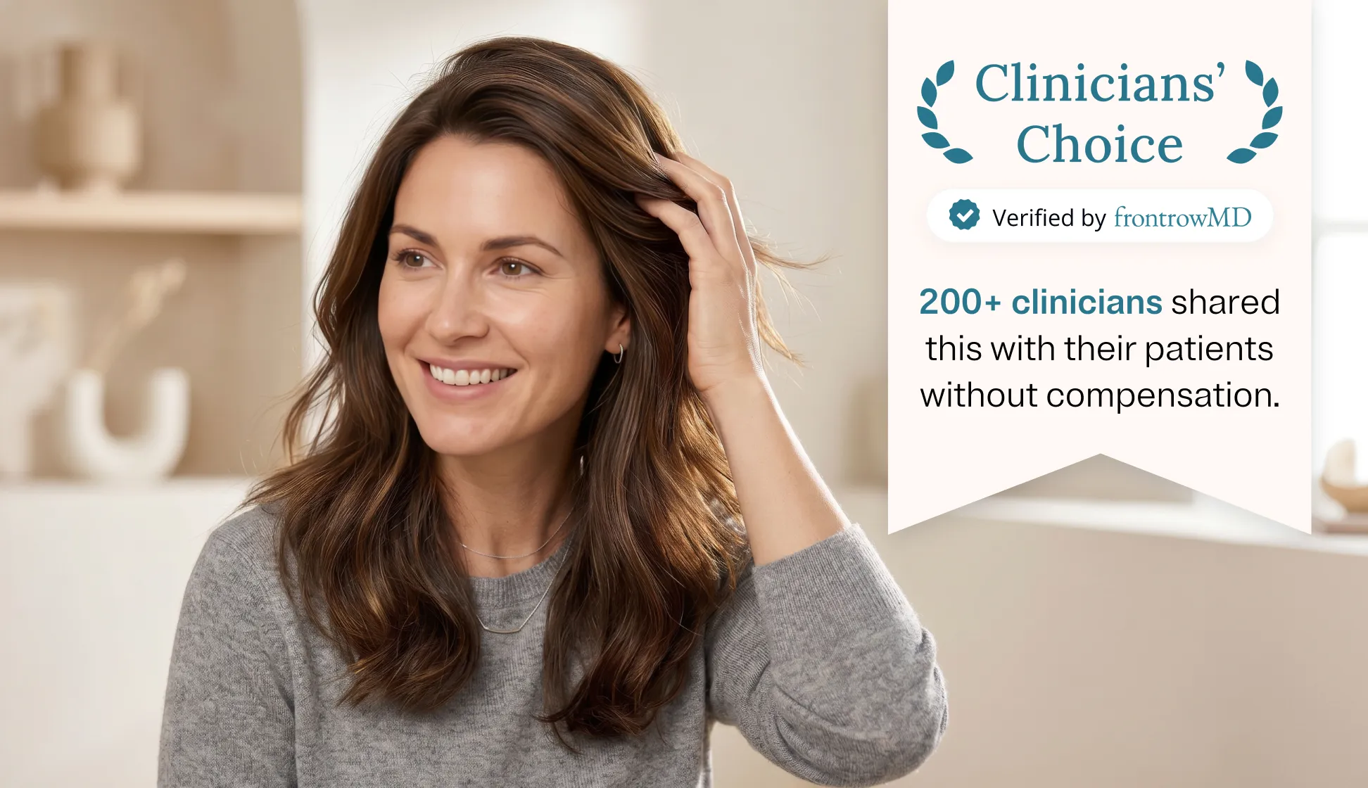 Smiling woman with long brown hair wearing a gray sweater touching her hair, with text on a banner stating 'Clinicians’ Choice, Verified by frontrowMD, 200+ clinicians shared this with their patients without compensation.'