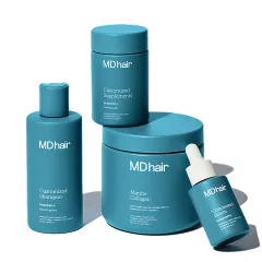Four teal-colored MDhair hair care products including Optimized Shampoo, Advanced Supplements, Marine Collagen, and a serum with dropper, arranged on a white background.