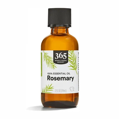 Amber bottle with black cap labeled 365 Whole Foods Market 100% Essential Oil Rosemary, 2 fluid ounces, featuring green rosemary illustrations on the label.