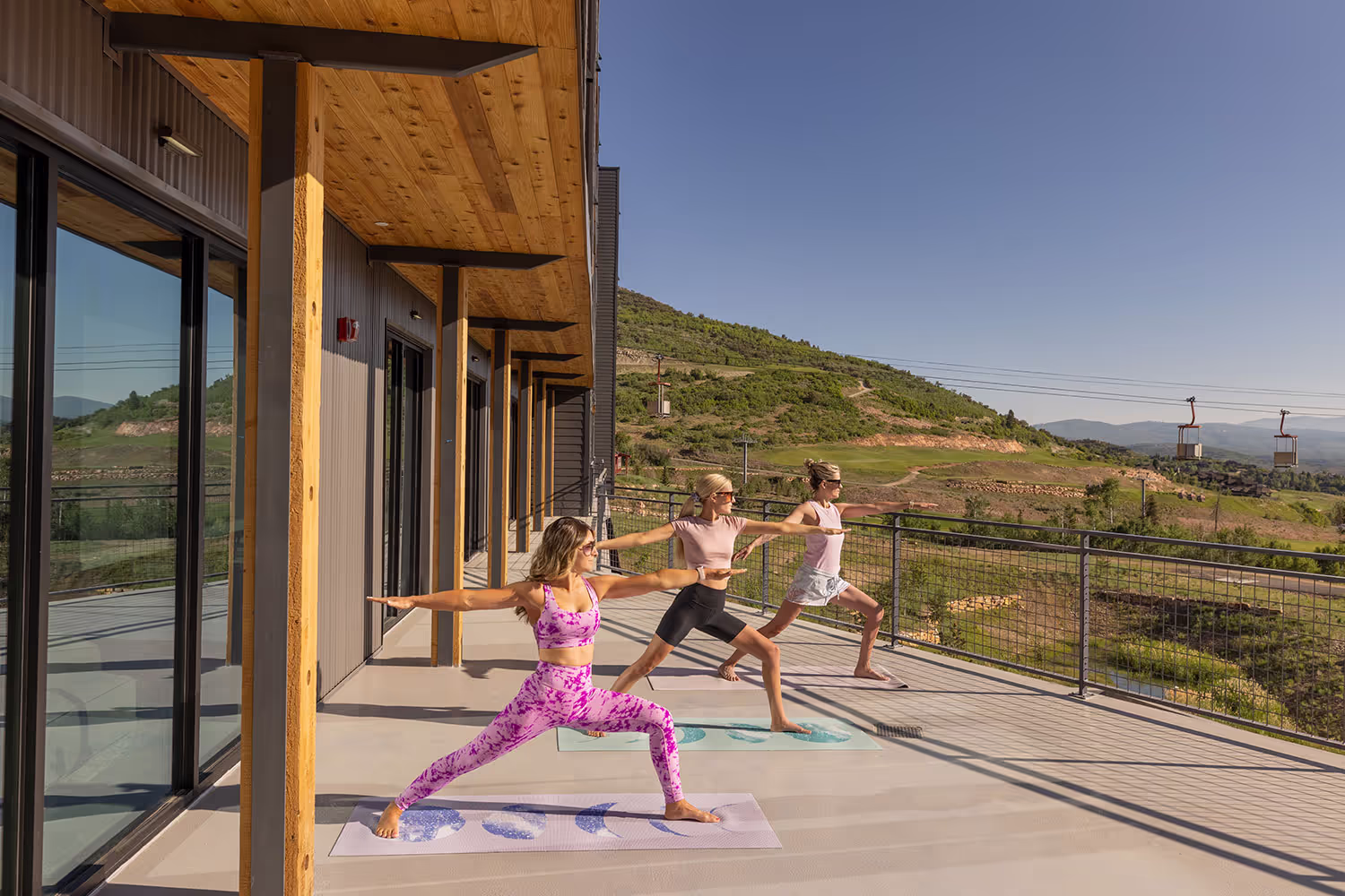 Women doing yoga on the terrace.
