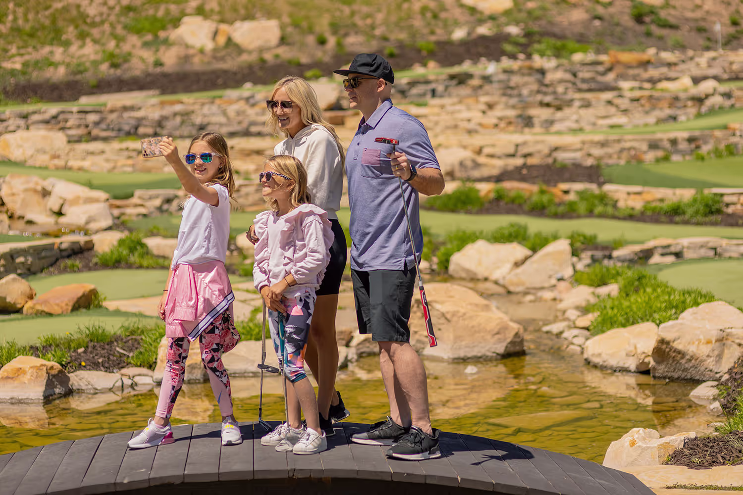 Family playing golf.