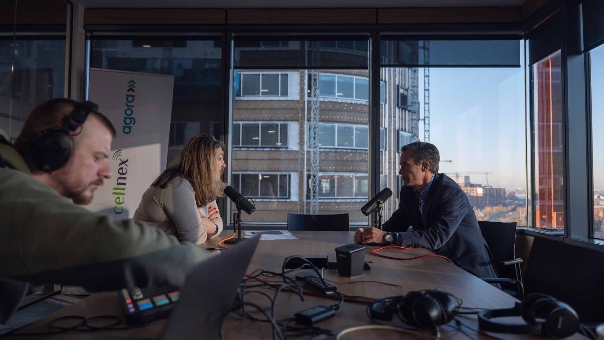 A man and woman chatting in an office.