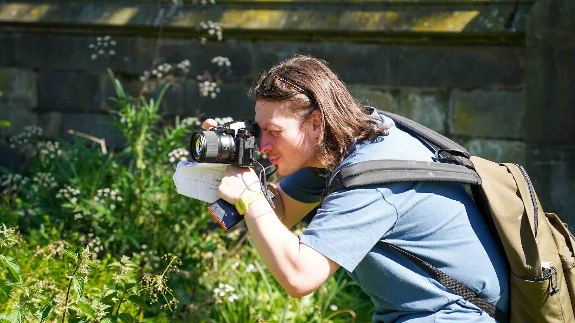 A producer filming outside.
