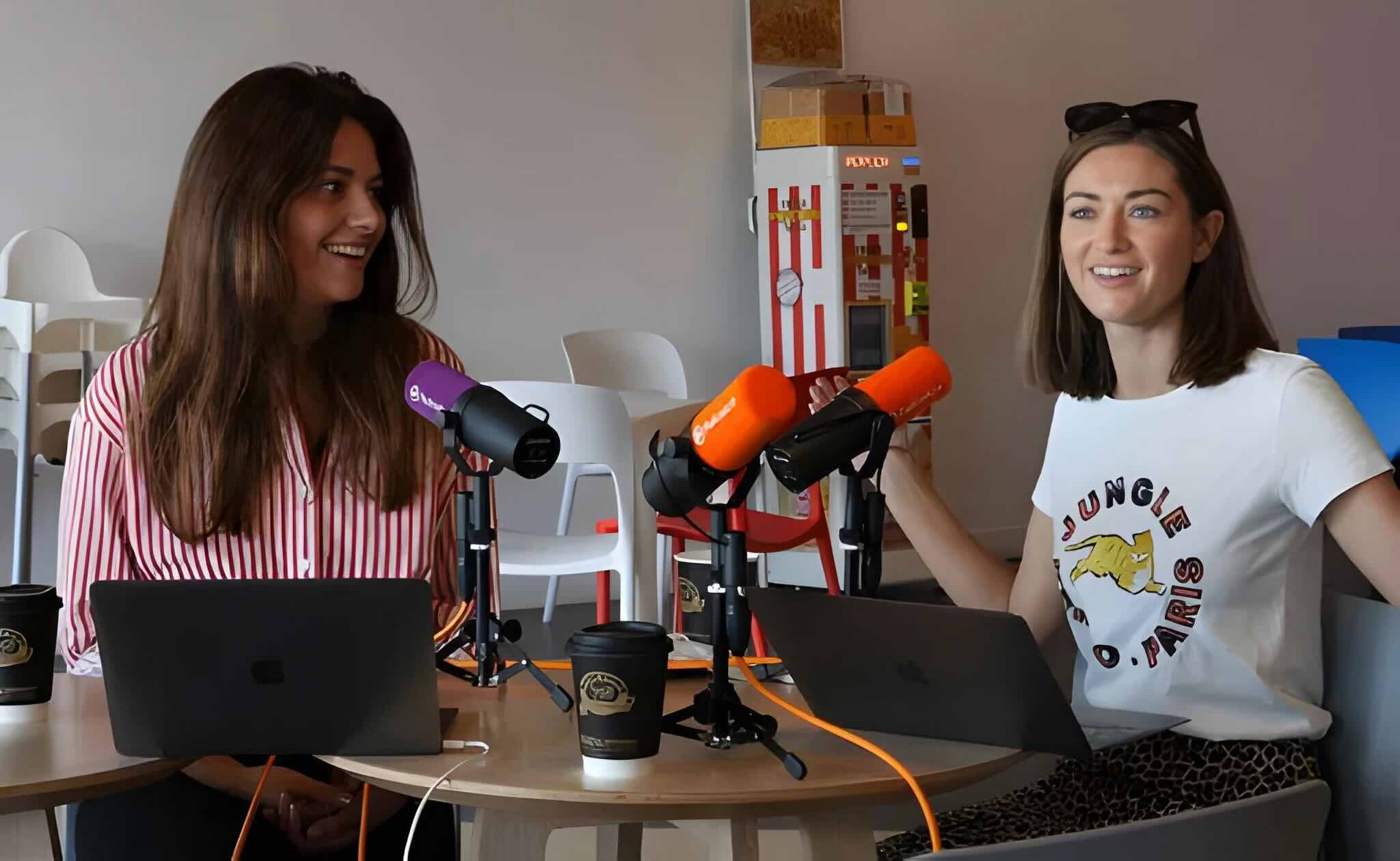 Two women chatting creating a podcast.