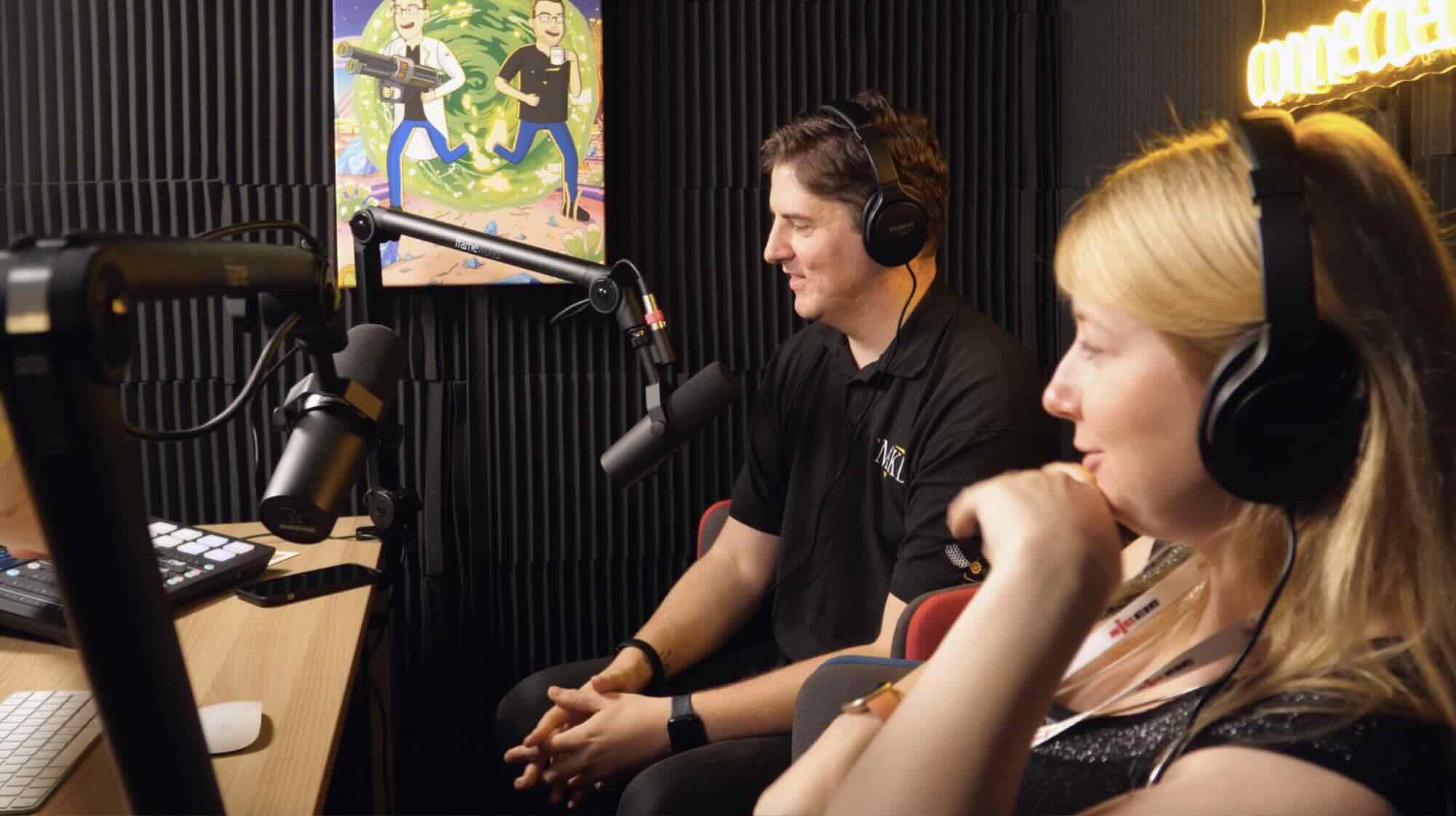 Two people recording a podcast in the studio.