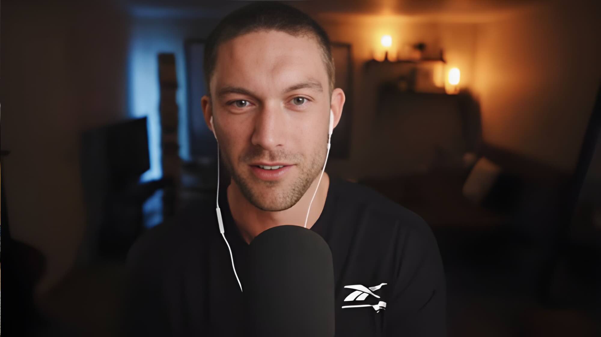 CEO in front of a microphone chatting for his podcast.