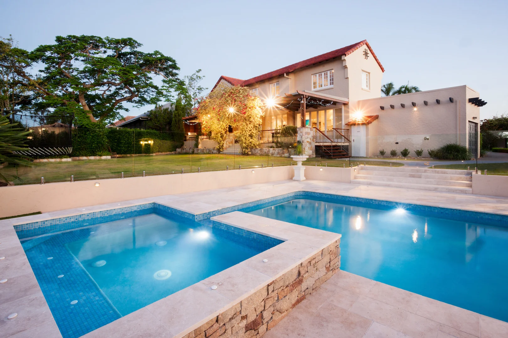 Beautiful blue clean pool in the backyard of luxury home in Phoenix