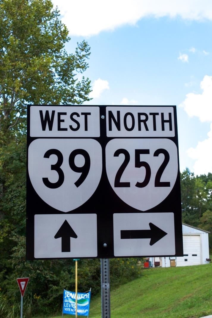 A close-up of a road signAI-generated content may be incorrect.