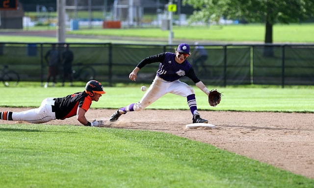 Two teens playing baseball