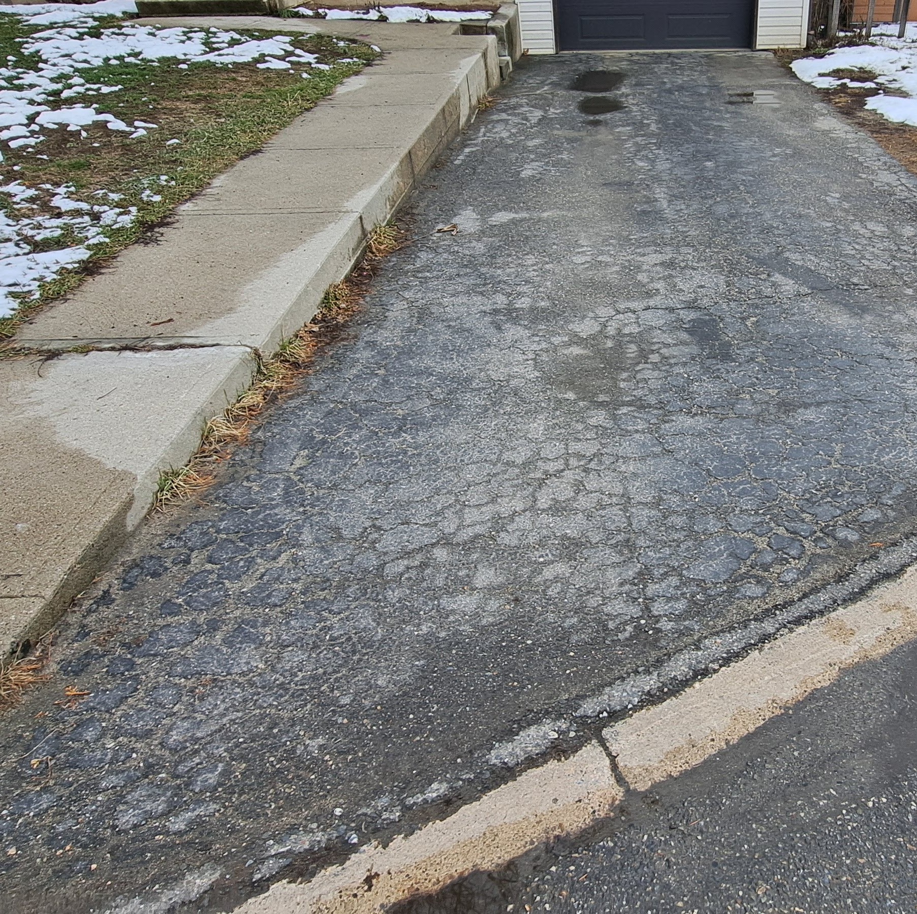 Before photo of cracked asphalt