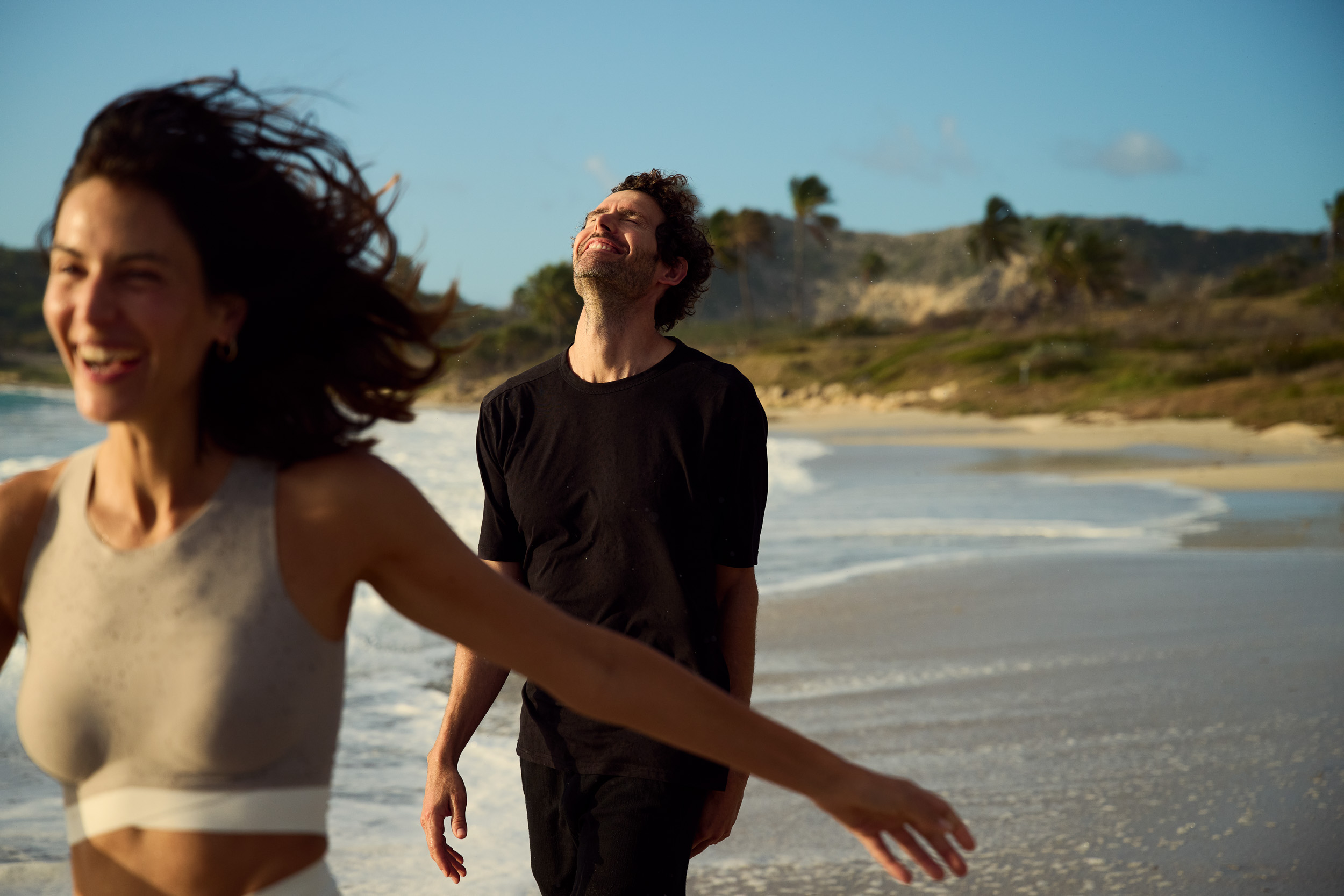 Couple on a Caribbean beach in warm natural light
