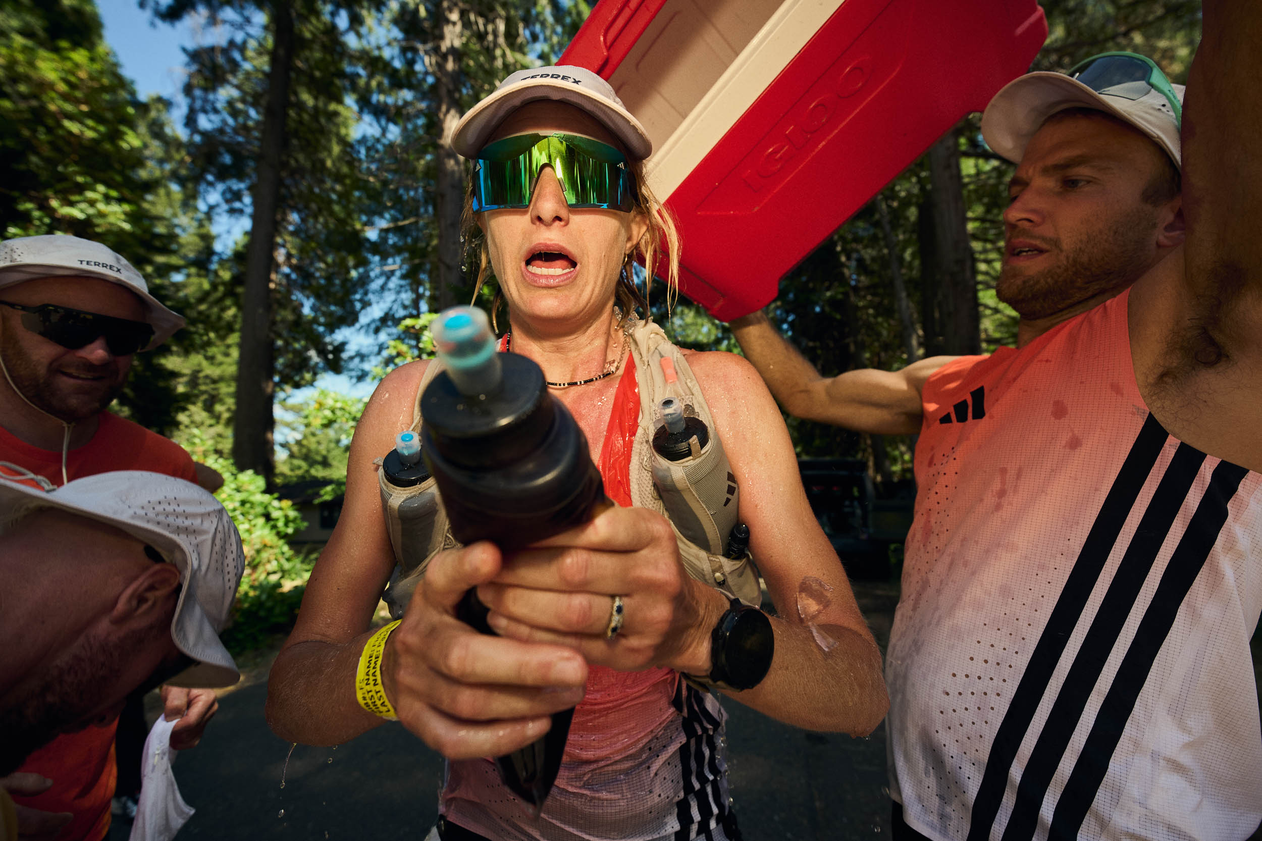Fiona Pascall holds out a bottle while her crew prepare her to leave.
