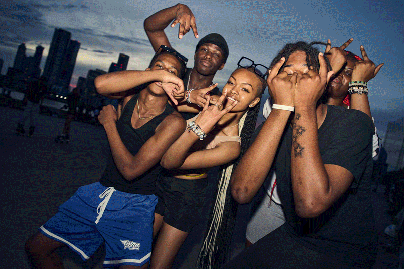 Groups of roller skaters talking, posing and hyping each other up at London skate meets at night.